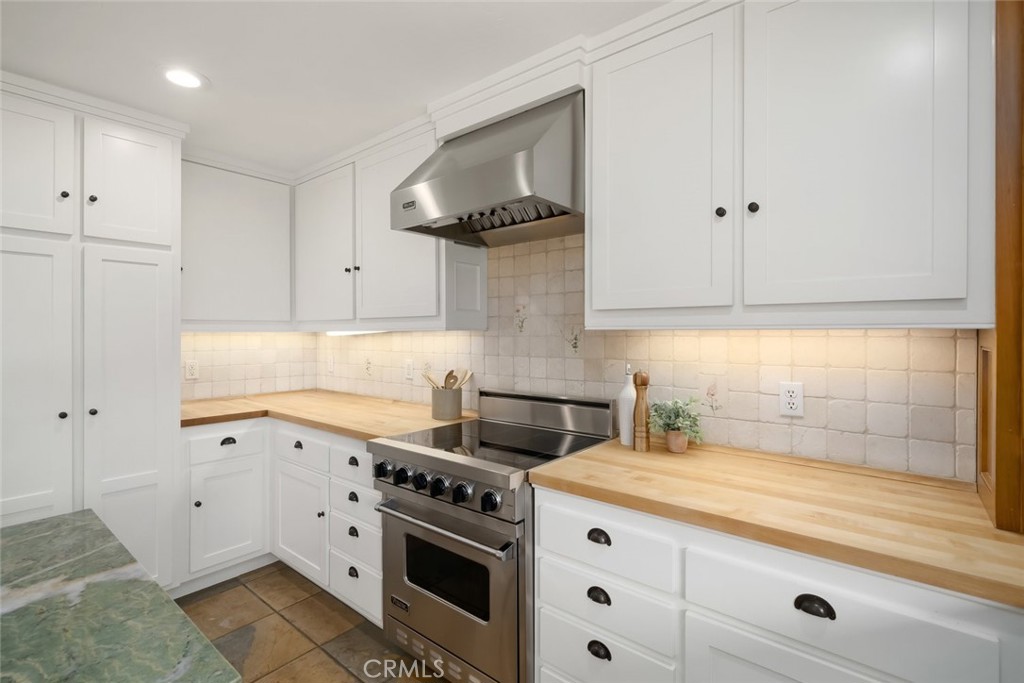 2650 Skyview Trail San Luis Obispo, CA 93405 - Photo 23 of 75 a kitchen with white cabinets and white appliances