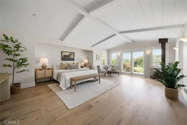 a view of a terrace with couches and wooden fence