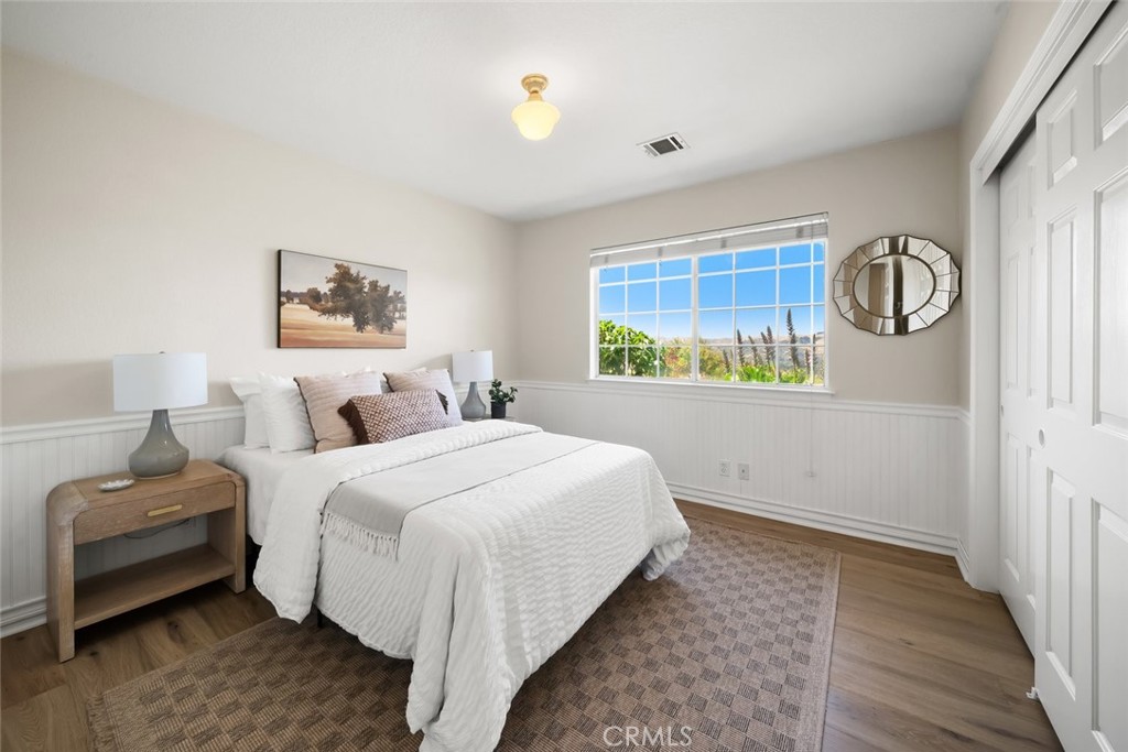 2650 Skyview Trail San Luis Obispo, CA 93405 - Photo 37 of 75 a bedroom with a bed and a painting on the wall