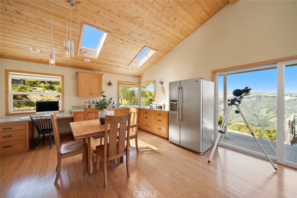 2650 Skyview Trail San Luis Obispo, CA 93405 - Photo 43 of 75 a kitchen with stainless steel appliances a dining table chairs and wooden floor