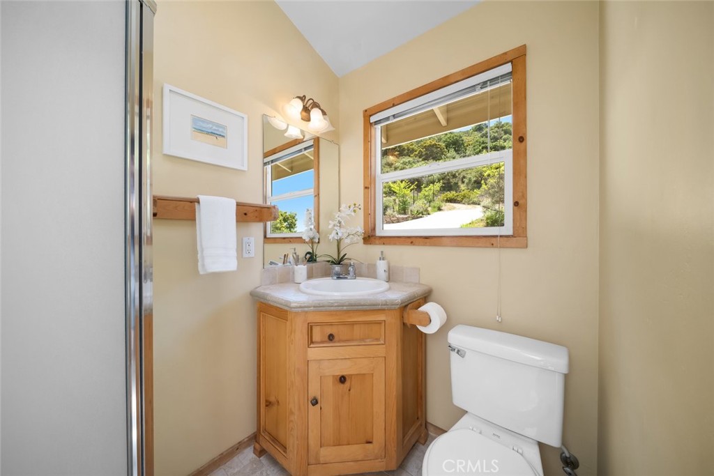2650 Skyview Trail San Luis Obispo, CA 93405 - Photo 52 of 75 a bathroom with a granite countertop toilet sink and mirror