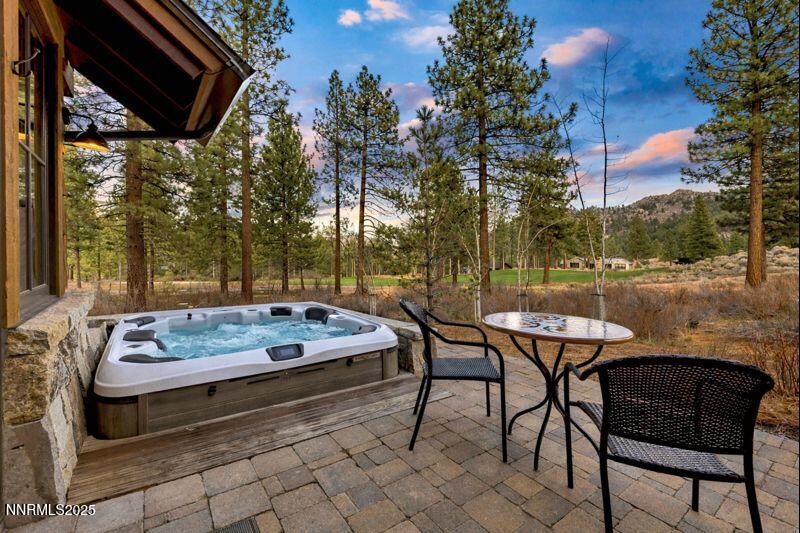 261 Redding Way Carson City, NV 89705 - Photo 64 of 90 a backyard of a house with table and chairs