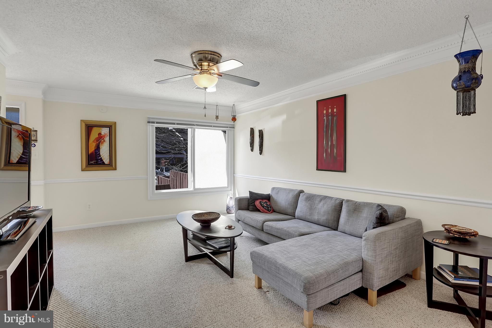 2413 Southgate Square Reston, VA 20191 - Photo 11 of 26 a living room with furniture and a flat screen tv