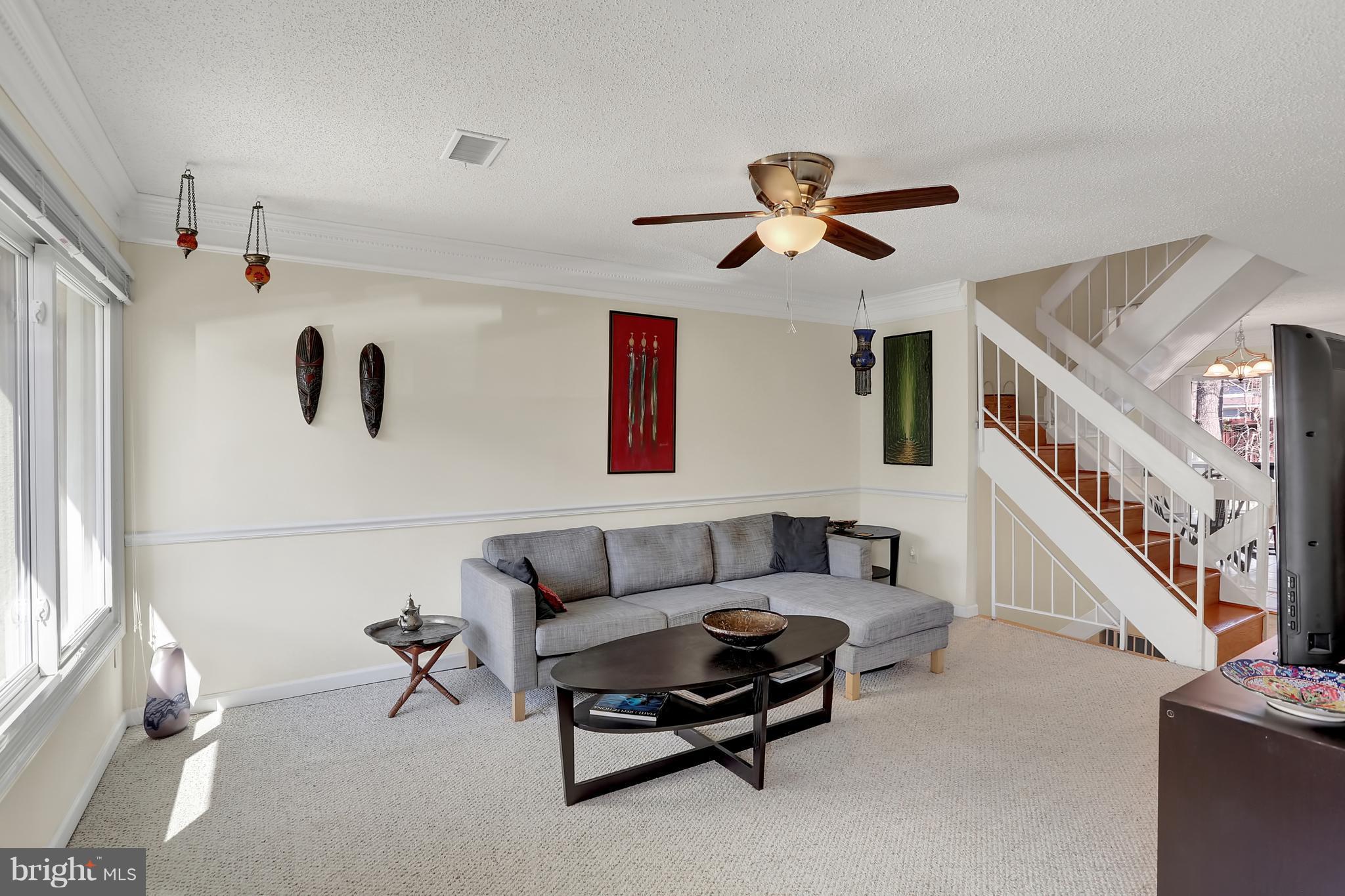2413 Southgate Square Reston, VA 20191 - Photo 12 of 26 a living room with furniture and a ceiling fan