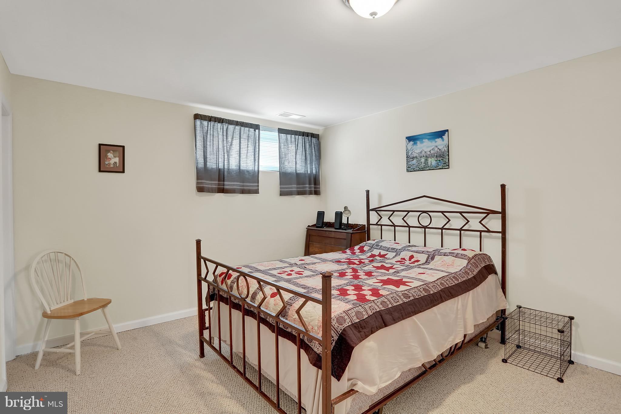 2413 Southgate Square Reston, VA 20191 - Photo 15 of 26 a bedroom with a bed and chair