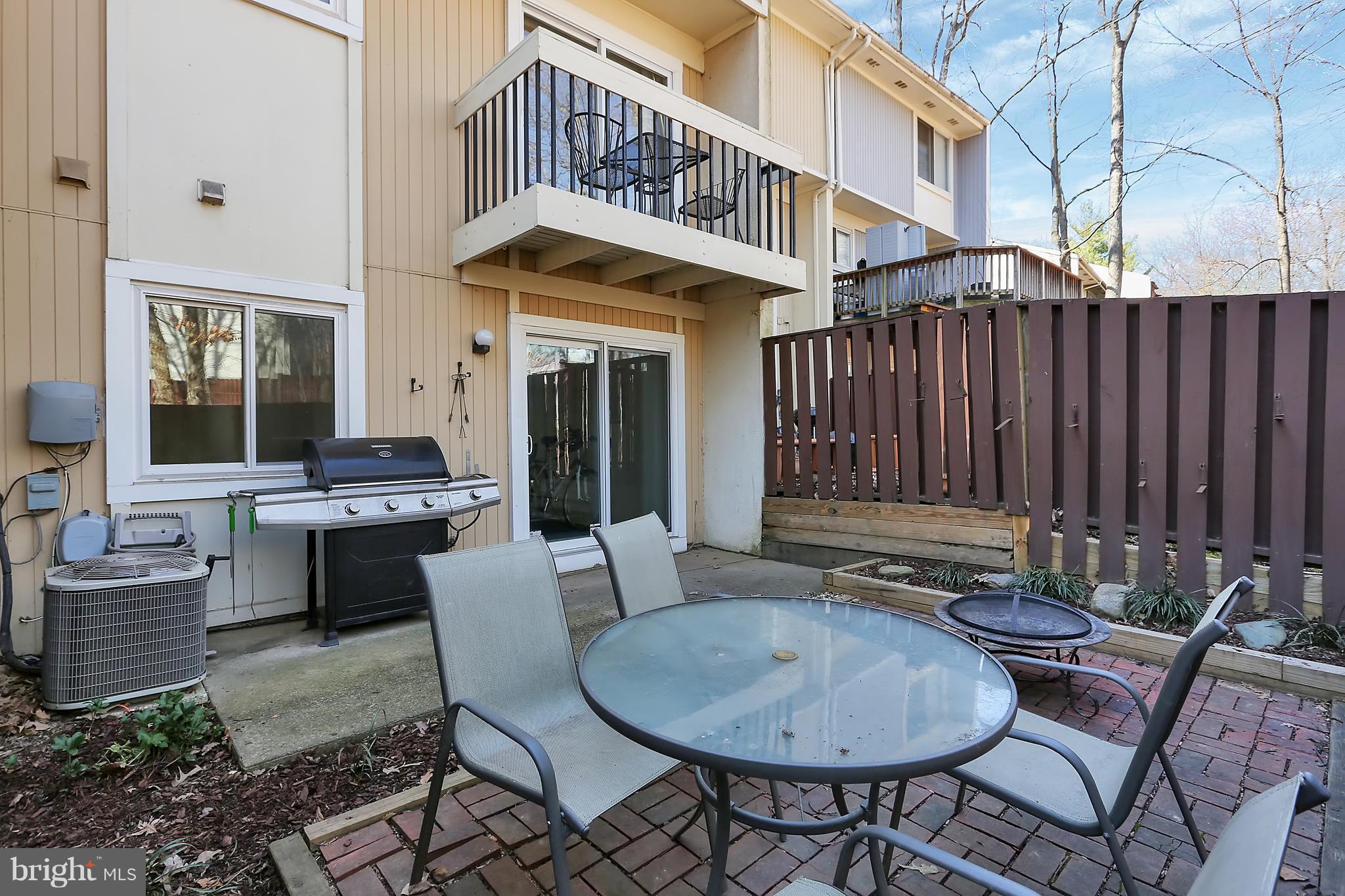 2413 Southgate Square Reston, VA 20191 - Photo 23 of 26 a balcony with table and chairs