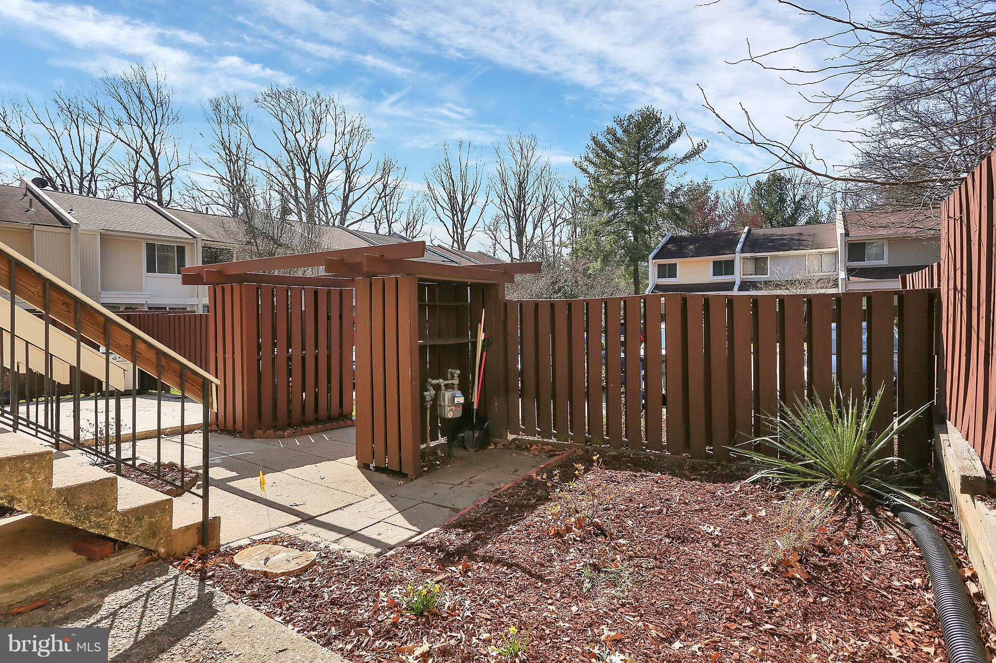 2413 Southgate Square Reston, VA 20191 - Photo 24 of 26 a view of a backyard with a fence