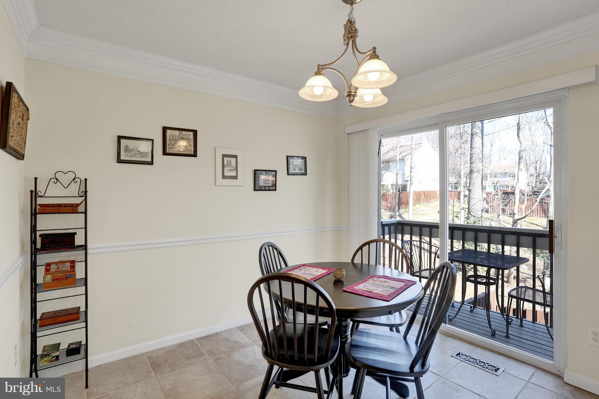 2413 Southgate Square Reston, VA 20191 - Photo 5 of 26 a view of a dining room with furniture window and outside view