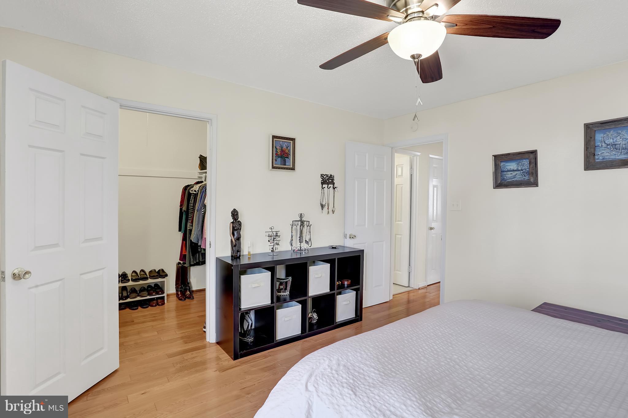 2413 Southgate Square Reston, VA 20191 - Photo 7 of 26 a bedroom with a bed and a chandelier