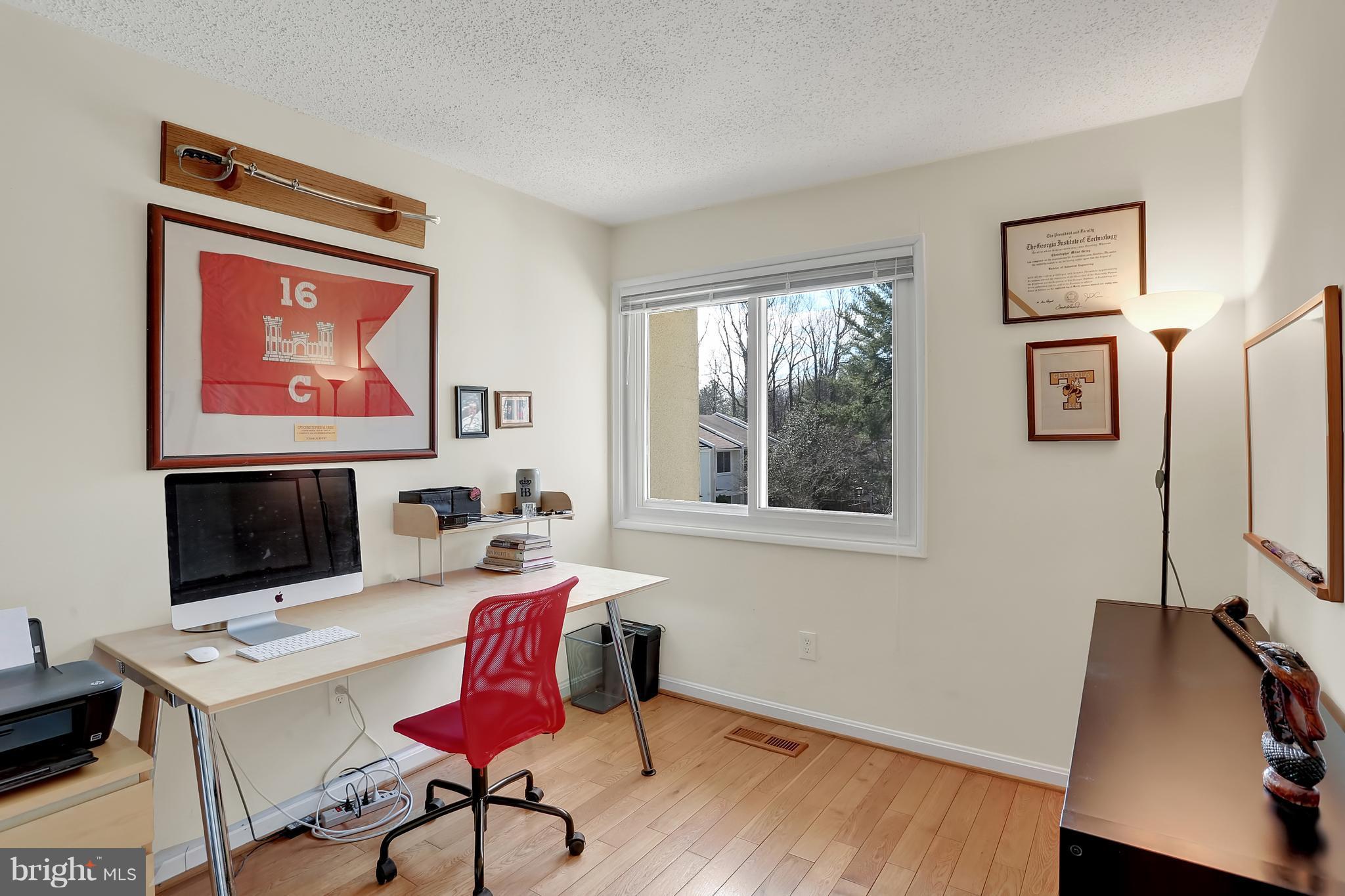 2413 Southgate Square Reston, VA 20191 - Photo 8 of 26 a workspace with furniture and a flat screen tv