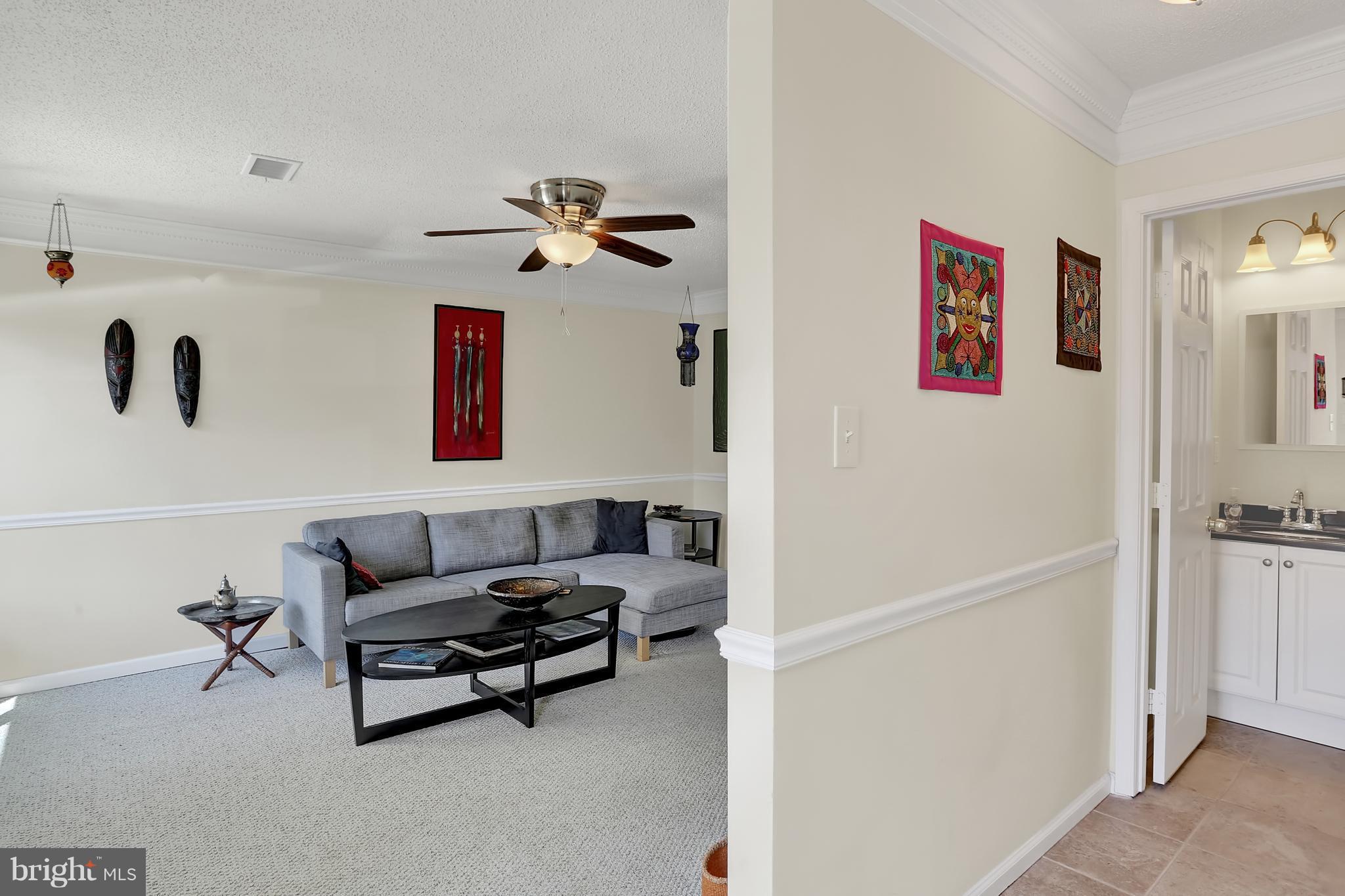 2413 Southgate Square Reston, VA 20191 - Photo 9 of 26 a living room with furniture and a table