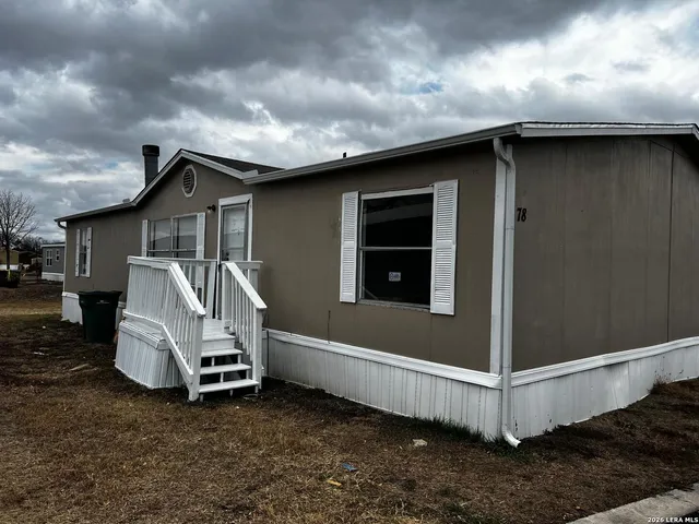a white house with a outdoor space