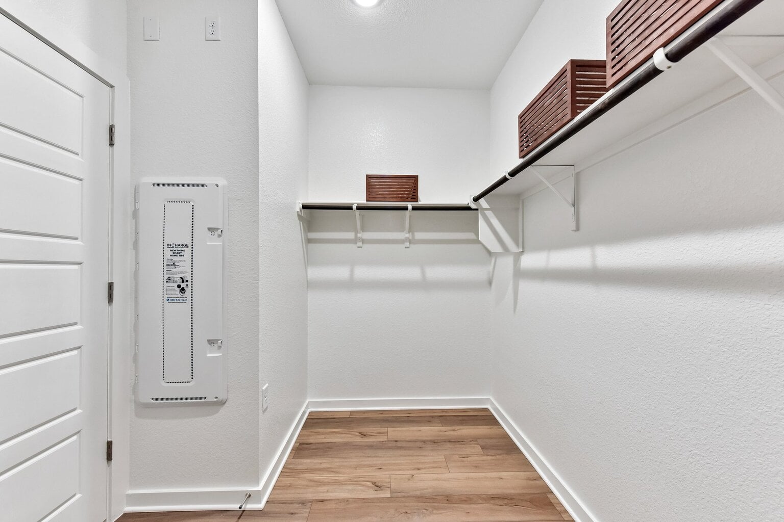 10609 Trifecta Way Buda, TX 78610 - Photo 8 of 17 Ample closet space awaits, featuring a hanging rod and convenient shelving.