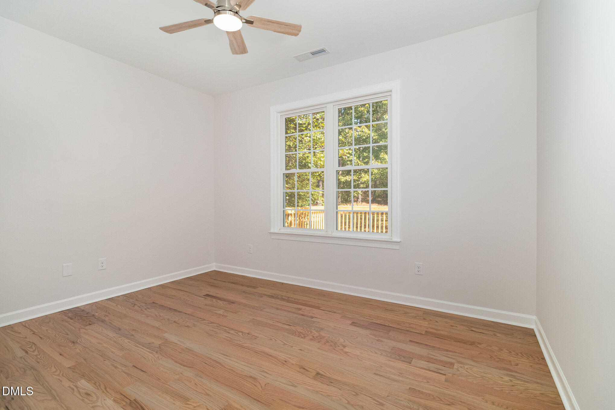 42 Racquet Court Sanford, NC 27332 - Photo 16 of 23 an empty room with a window