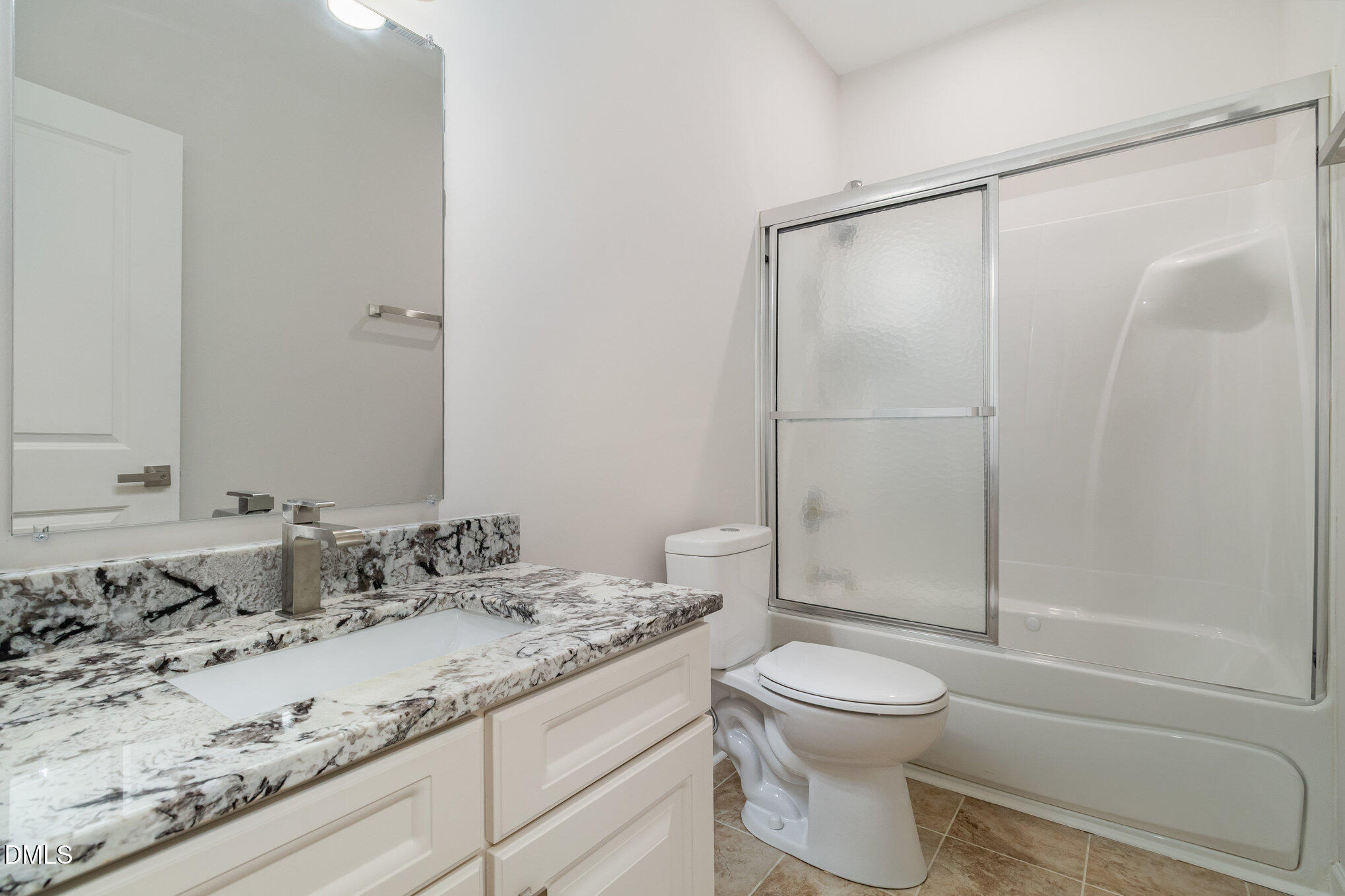 42 Racquet Court Sanford, NC 27332 - Photo 17 of 23 a bathroom with a granite countertop sink toilet and shower