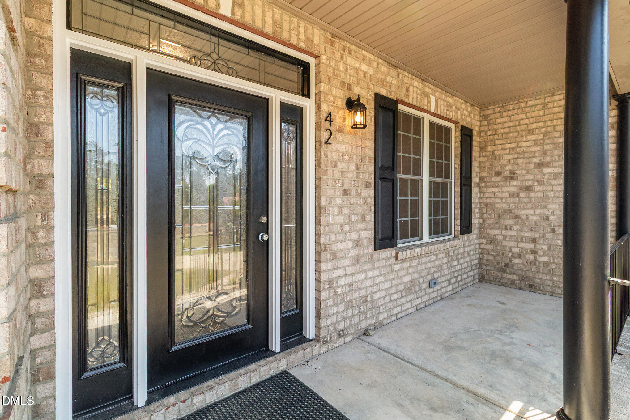 42 Racquet Court Sanford, NC 27332 - Photo 3 of 23 a view of a brick house with windows