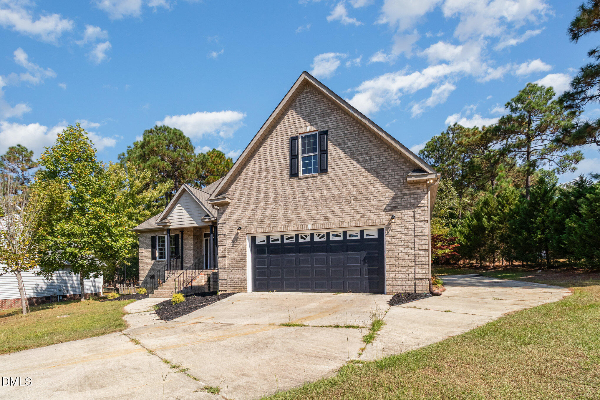 42 Racquet Court Sanford, NC 27332 - Photo 4 of 23 a front view of a house with a yard