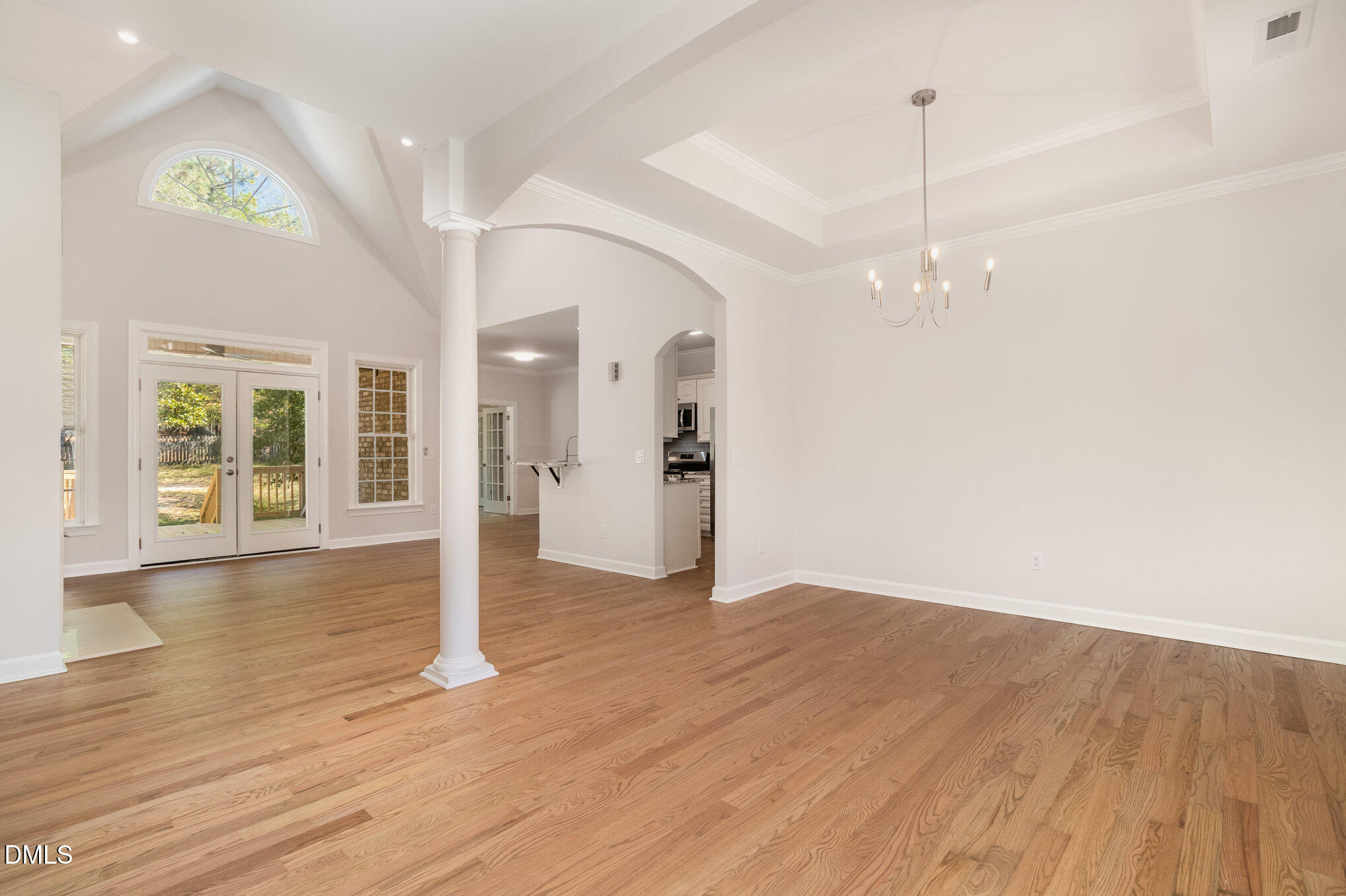 42 Racquet Court Sanford, NC 27332 - Photo 6 of 23 a view of a room with wooden floor staircase and a kitchen