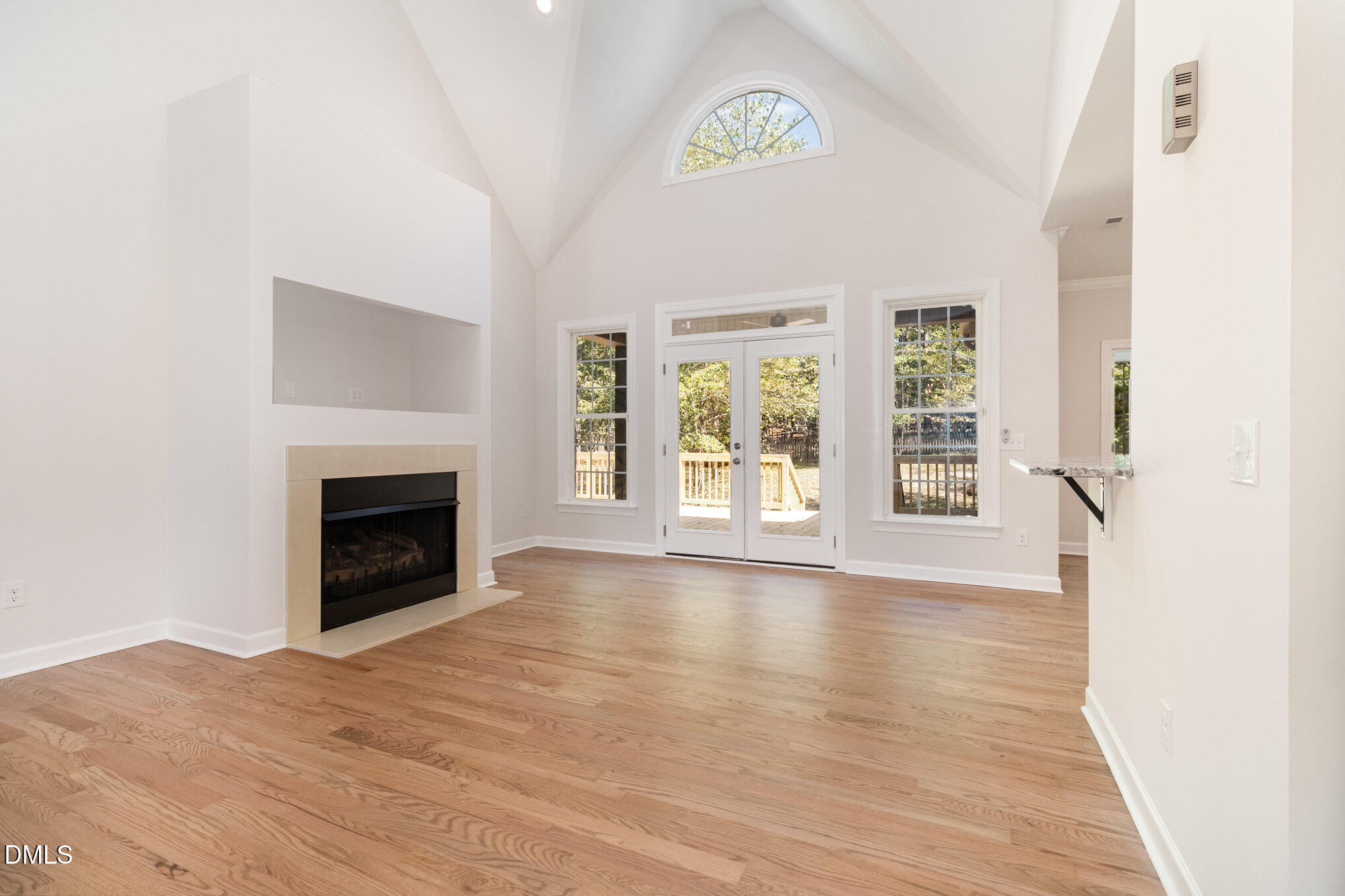 42 Racquet Court Sanford, NC 27332 - Photo 8 of 23 an empty room with windows and fireplace