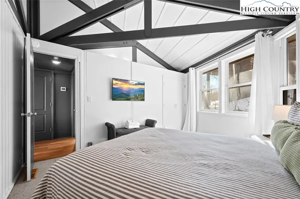 a bathroom with a granite countertop sink a mirror a vanity and bathtub