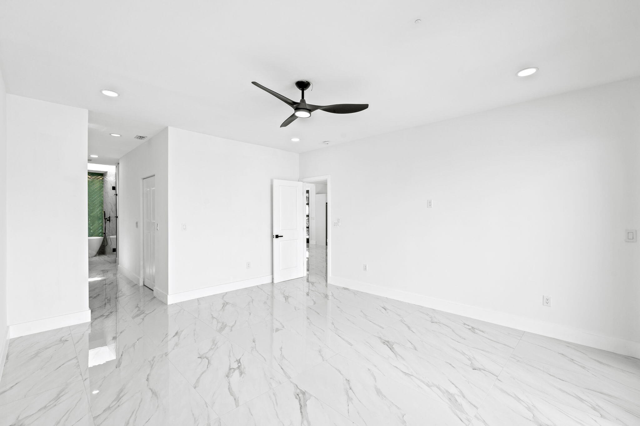6567 Via Benita Boca Raton, FL 33433 - Photo 18 of 63 an empty room with closet and a ceiling fan