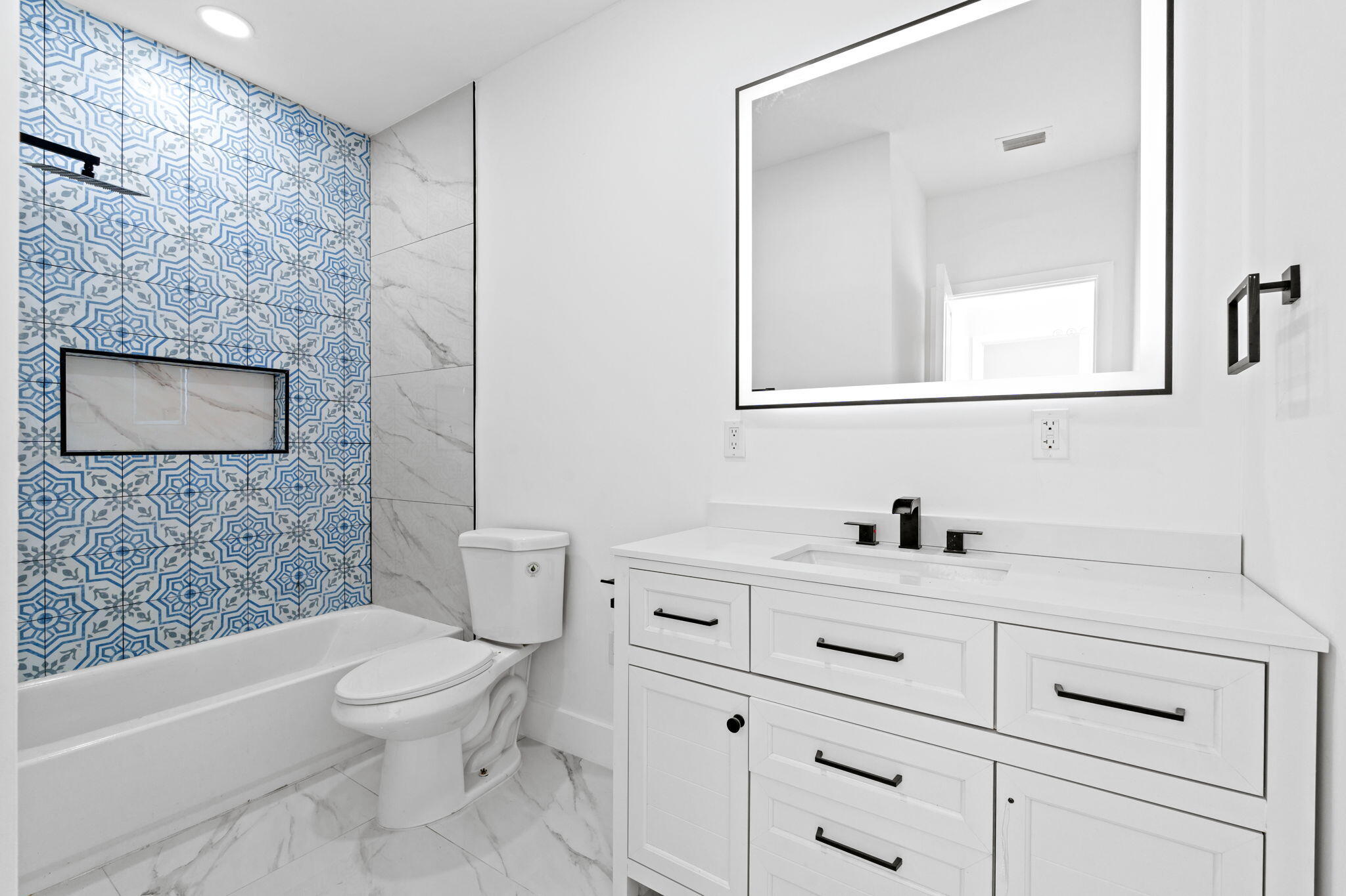 6567 Via Benita Boca Raton, FL 33433 - Photo 30 of 63 a bathroom with a sink a toilet and shower