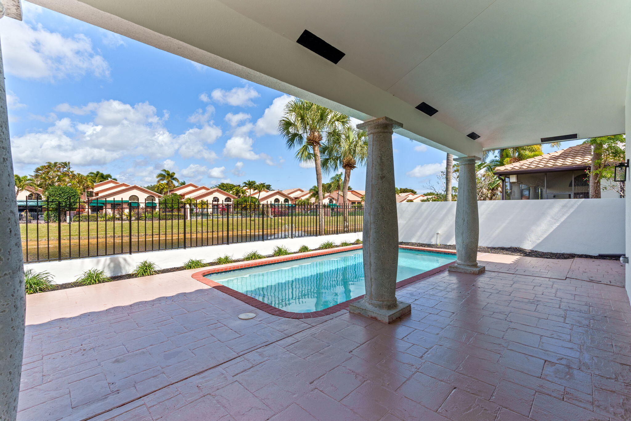 6567 Via Benita Boca Raton, FL 33433 - Photo 41 of 63 a view of swimming pool with seating space