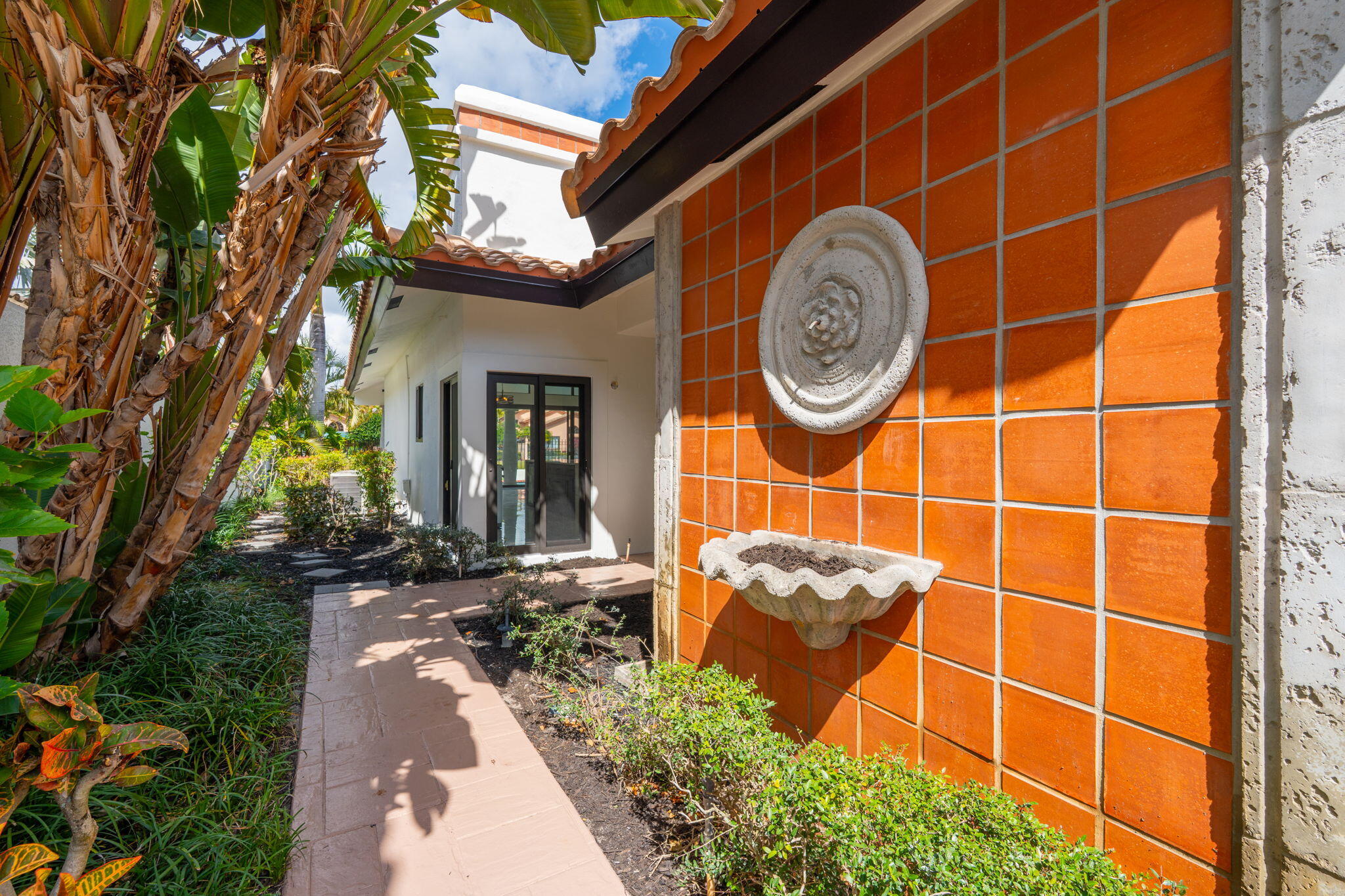 6567 Via Benita Boca Raton, FL 33433 - Photo 9 of 63 a view of a door with a tree in front of it