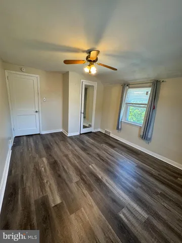a view of room with a ceiling fan
