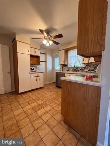 a kitchen with stainless steel appliances a stove refrigerator sink and cabinets