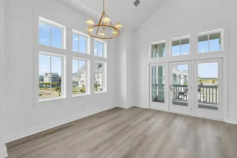 a view of an entryway with wooden floor