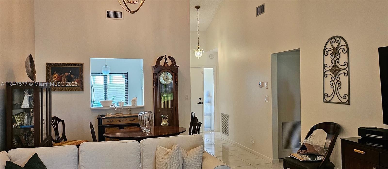 10872 Lake Front Place Boca Raton, FL 33498 - Photo 7 of 57 Peephole from dinning area to kitchen