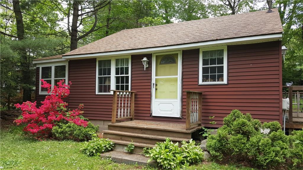 29 Island Beach Road Lebanon, CT 06249 - Photo 1 of 1 a front view of a house with a yard and potted plants