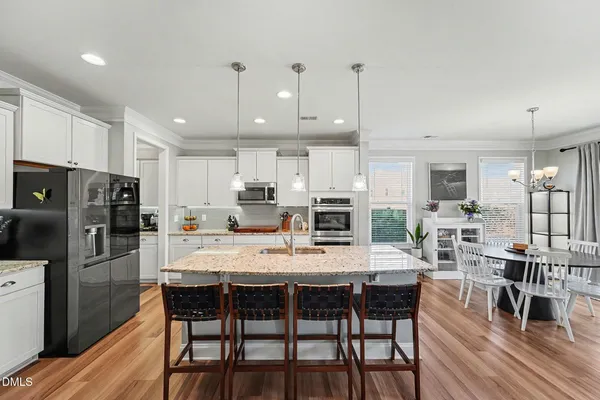 a view of a livingroom with workspace and a window
