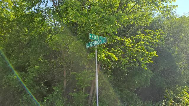 19-w068 North Avenue Lombard, IL 60148 - Photo 2 of 7 a backyard of a house with lots of green space and a fountain