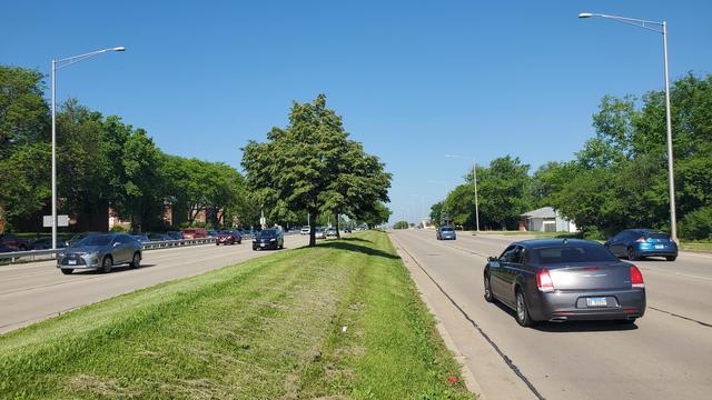 19-w068 North Avenue Lombard, IL 60148 - Photo 6 of 7 a view of a back yard of the house with parked cars