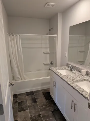 a view of a hallway to rooms