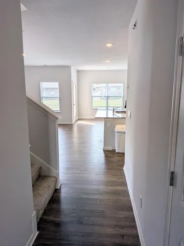 a view of entryway with wooden floor
