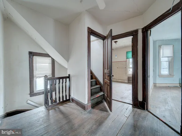 a view of an entryway with hardwood floor and interior