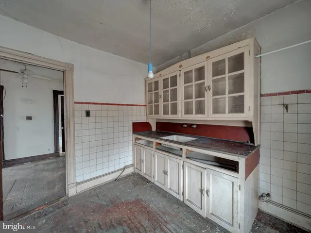 a kitchen with stainless steel appliances a stove and a refrigerator