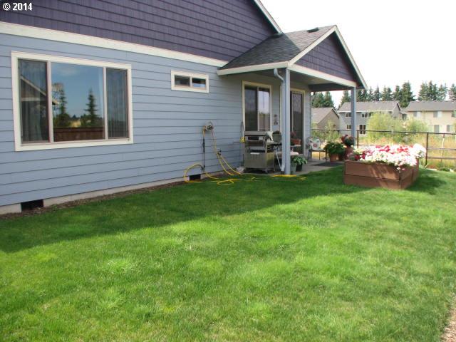 3702 North 3rd Circle Ridgefield, WA 98642 - Photo 15 of 16 a front view of a house with garden