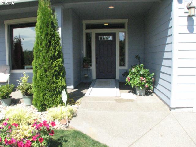 3702 North 3rd Circle Ridgefield, WA 98642 - Photo 2 of 16 a view of a pathway with flower pots