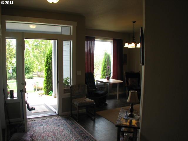 3702 North 3rd Circle Ridgefield, WA 98642 - Photo 3 of 16 a living room with furniture and a large window
