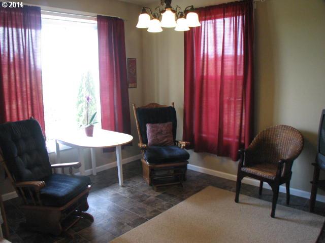 3702 North 3rd Circle Ridgefield, WA 98642 - Photo 4 of 16 a living room with furniture and a potted plant