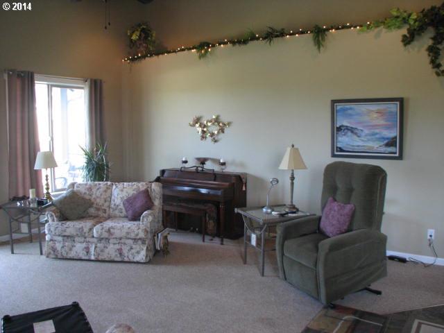 3702 North 3rd Circle Ridgefield, WA 98642 - Photo 7 of 16 a living room with furniture and a window