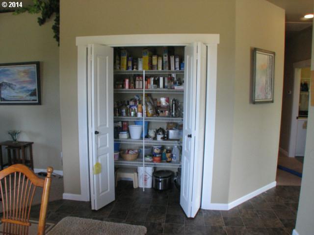 3702 North 3rd Circle Ridgefield, WA 98642 - Photo 10 of 16 a living room with furniture and a book shelf