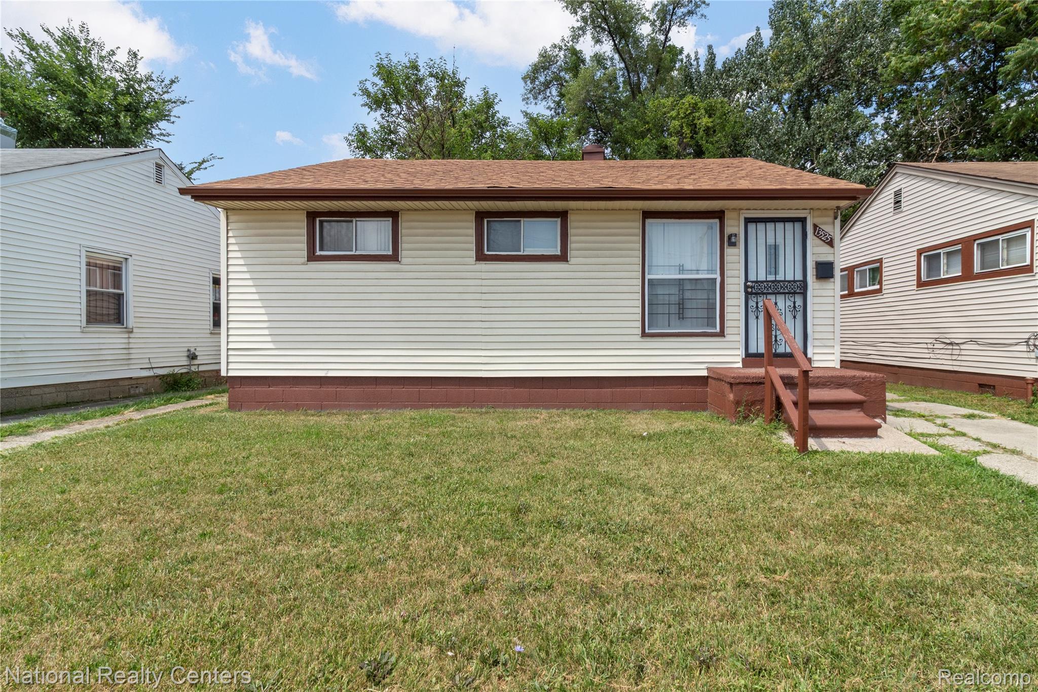 13525 Evergreen Road Detroit, MI 48223 - Photo 1 of 25 Ranch-style residence featuring light-colored horizontal siding and brown trim