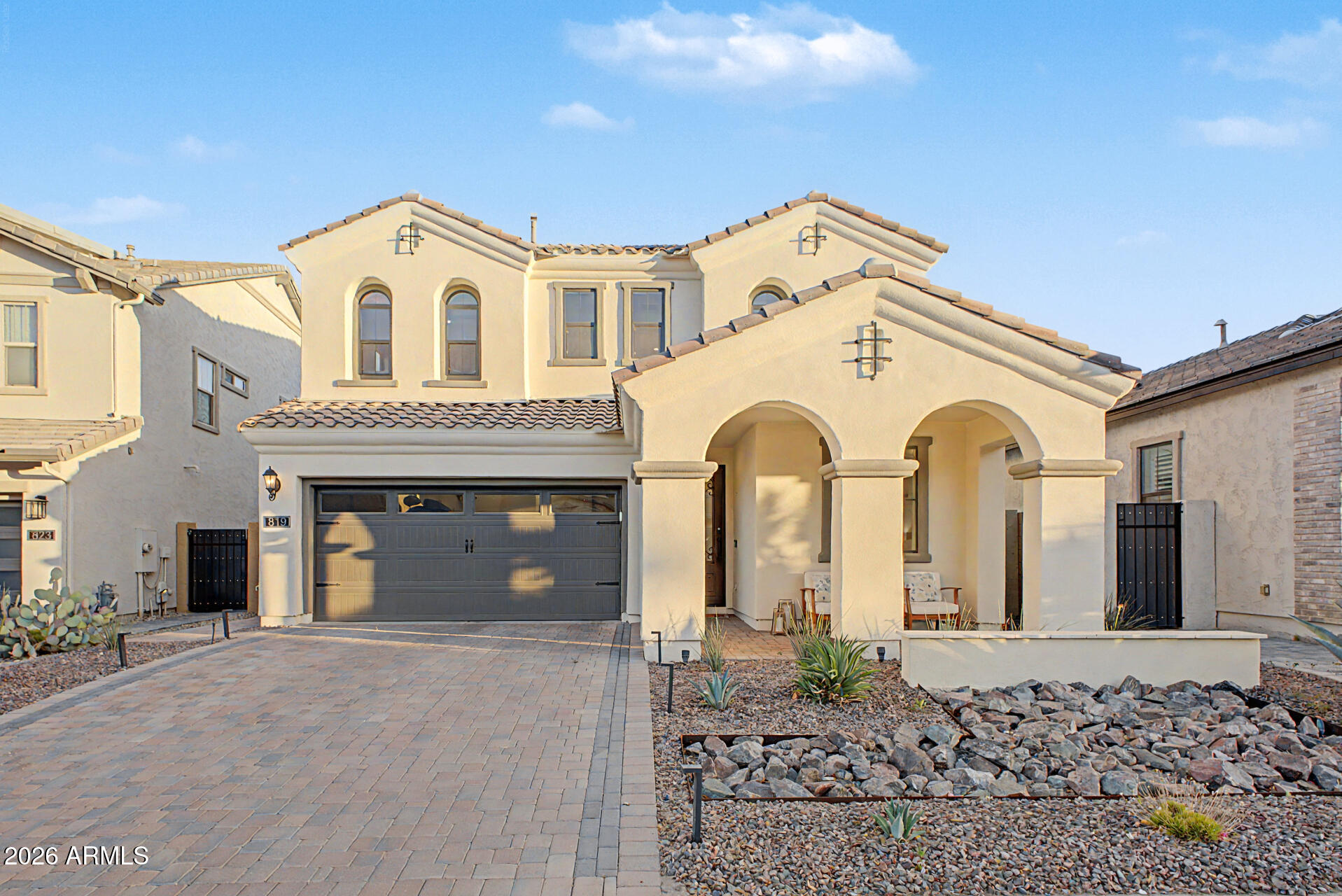 819 West Deer Creek Road Phoenix, AZ 85048 - Photo 6 of 76 a view of a white house with large windows