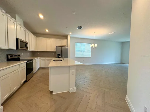 a large kitchen with cabinets