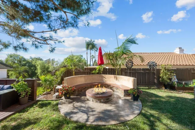 a swimming pool with outdoor seating